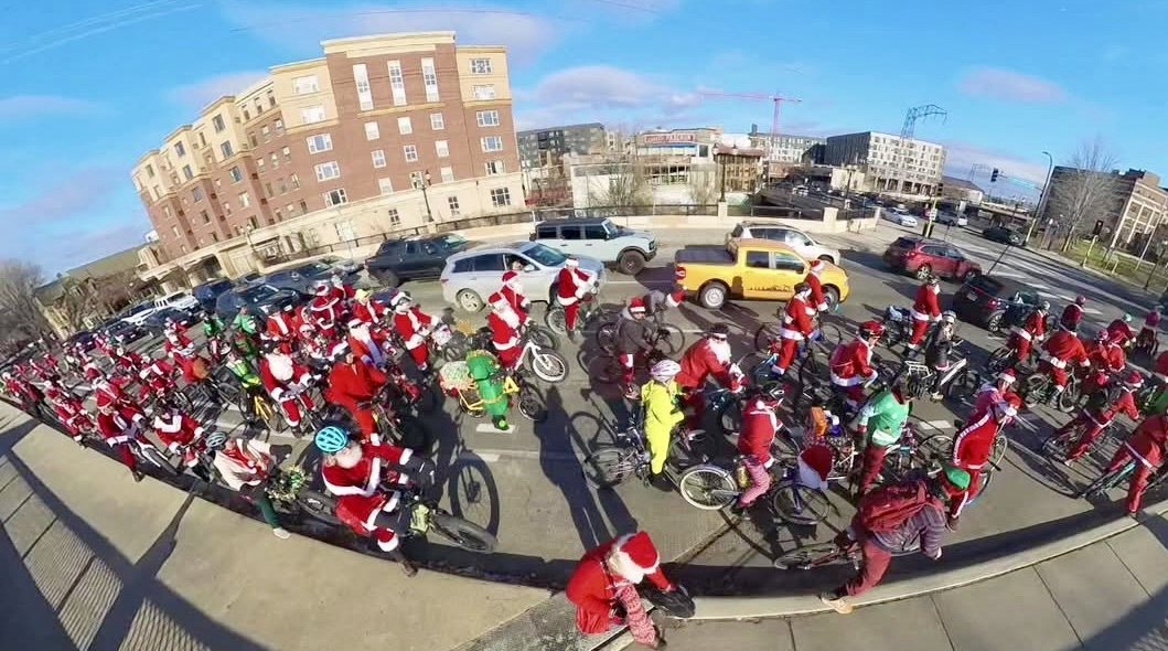 A huge stream of Santa cyclists seen from above