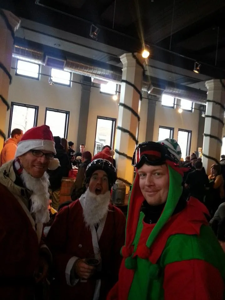 Three early riders in Santa and elf costumes