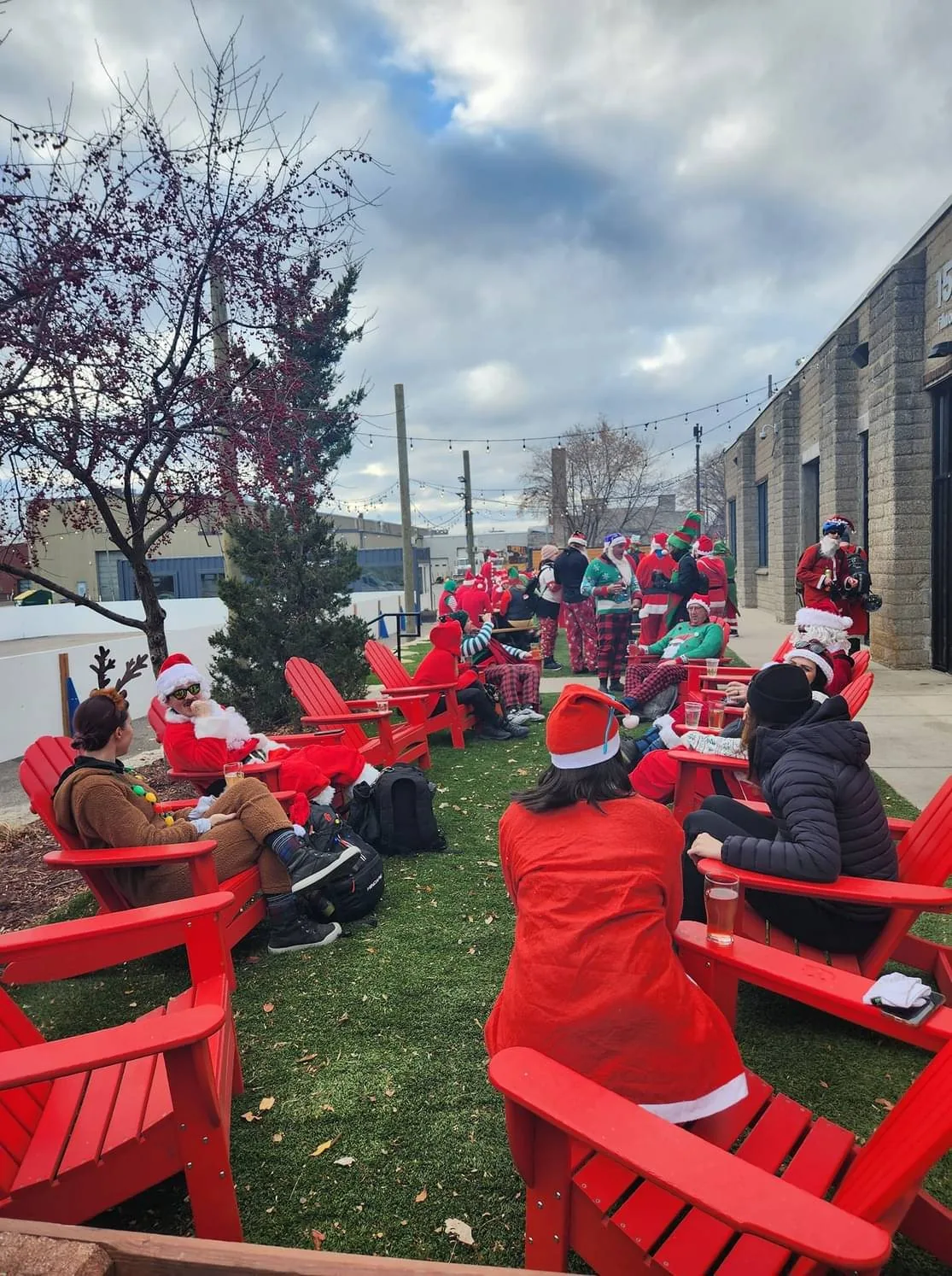 Santa riders relaxing outside a brewery
